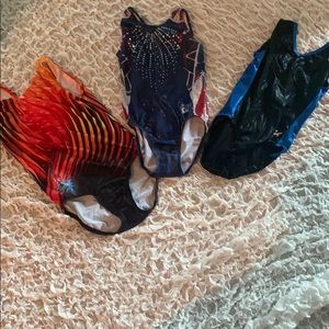 A set of 3 gymnastics GK leotards